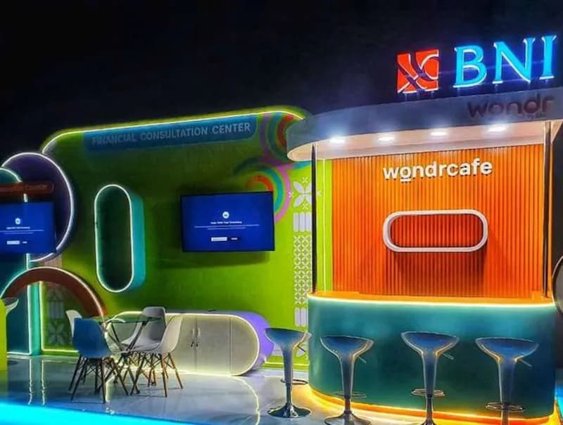 A BNI wondr café booth with neon-edged panels and a financial consultation corner